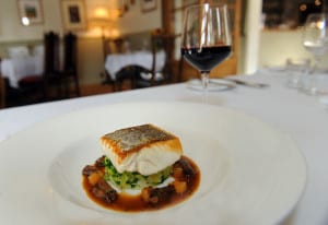 26/2/15   A main course of  east coast hake, slow cooked oxtail, creamed celeriac, savoy cabbage and cooking juices  at The Buck Inn at Maunby near Thirsk. (GL1005/12l)