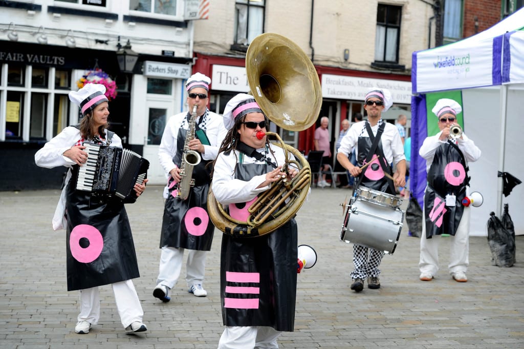 Date:13th July 2014.Picture James Hardisty, (JH1004/45b). Pontefract Liquorice Festival, Pictured Street entertainment by Skiband.