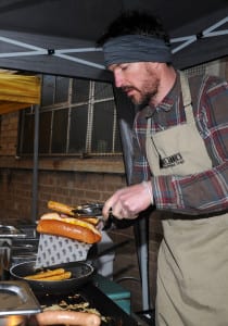 James Stock, of Fat Annie's makes a hot dog at the outdoor food market on Arundel Street. Andrew Roe